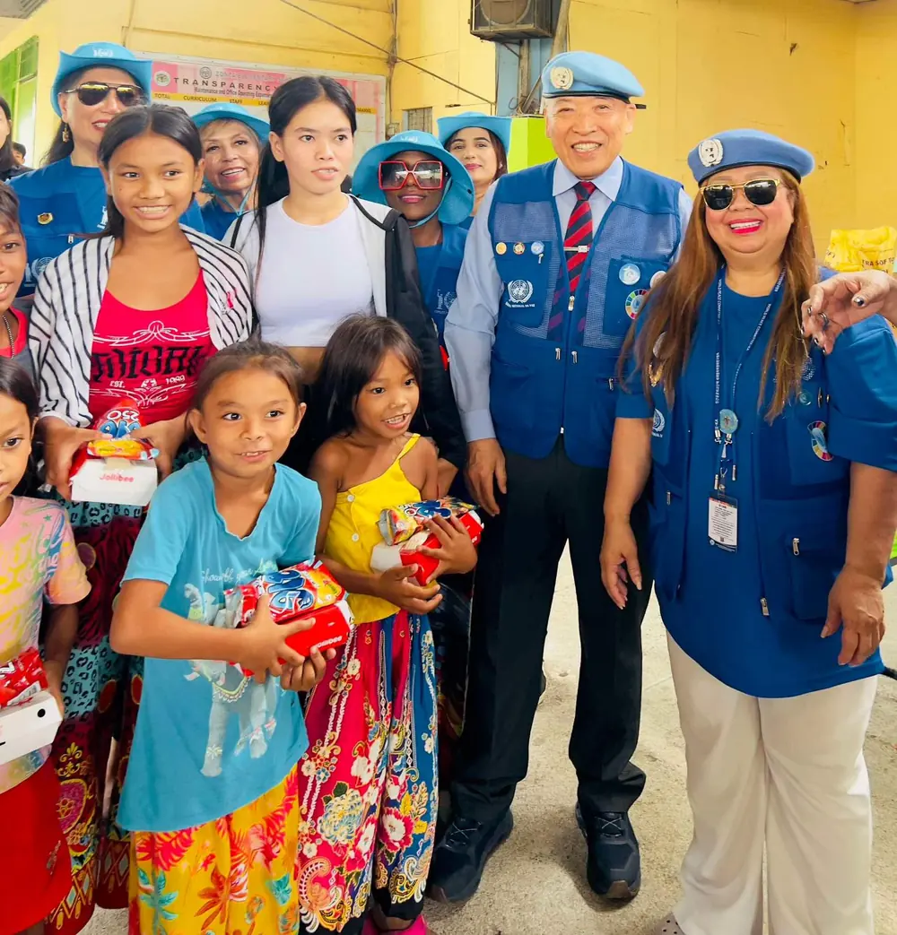 GTS volunteers with children at a community outreach event